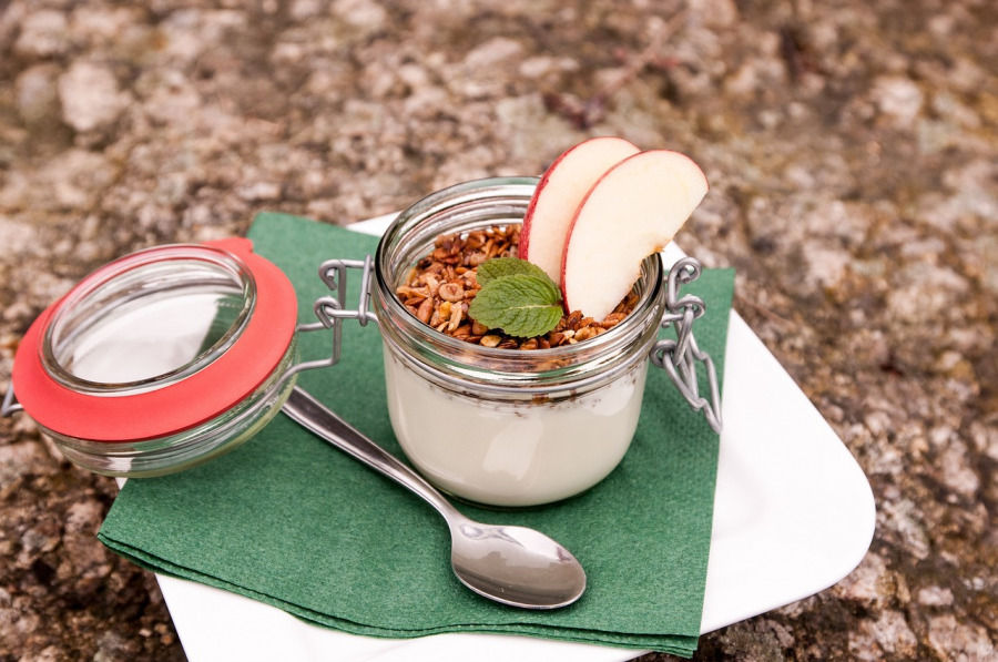 Fresh natural yogurt in a glass jar